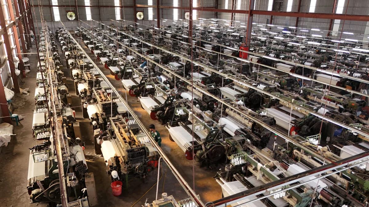 Power loom weaving floor at the Dream Textiles factory
