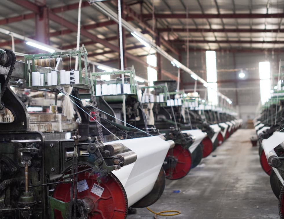 Power looms in operation